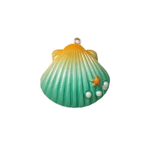 Gradient yellow and green shell pendant with star and pearl detail on white background