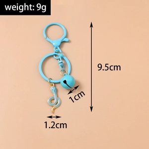 Sky blue snake charm keychain with golden lobster clasp and bell pendant detail