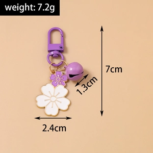 Detail view of purple cherry blossom keychain with size markings and weight at 7.2g