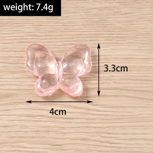 Pink transparent resin butterfly pendant showing 4cm width and 3.3cm height dimensions