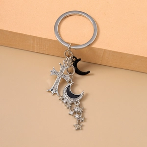 Porte-clés gothique argenté avec croix, pendentifs lune et pompons en étoiles