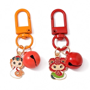 Cartoon zodiac snake keychain with colorful enamel pendants and bells on white background