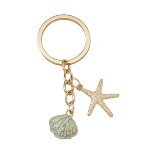 Golden starfish and blue shell keychain with rhinestones on a white background