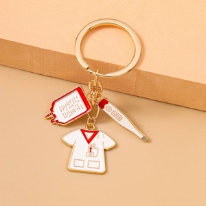 Detail of medical nurse keychain with blood bag, thermometer and uniform charms