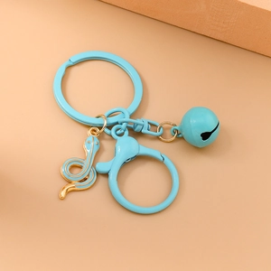 Detail of sky blue snake keychain with a matching metal bell and lobster clasp