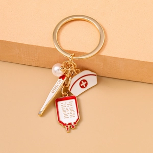 Detail view of medical theme keychain with nurse hat, thermometer and blood bag pendants
