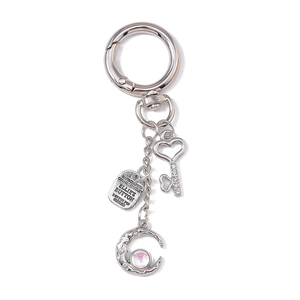 Silver metal keychain with heart key charm, engraved tag, and crescent moon pendant