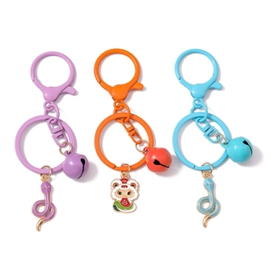 Three colorful zodiac snake keychains with bells and lobster clasps in purple, orange and blue