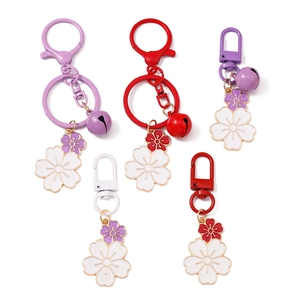 Set of five cherry blossom keychains with double-layer enamel petals and small bells