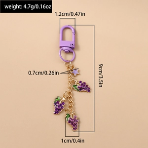 Detailed view of purple grape keychain with star charm and dimensions marked on it