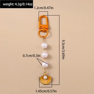 Detail showing dimensions of heart shell keychain with white pearls and orange lobster clasp