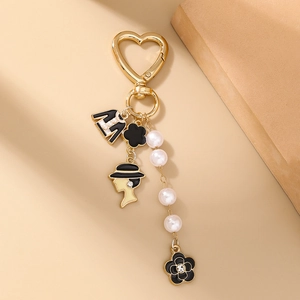 Elegant fashion keychain with pearl chain flower and portrait pendants on gold clip