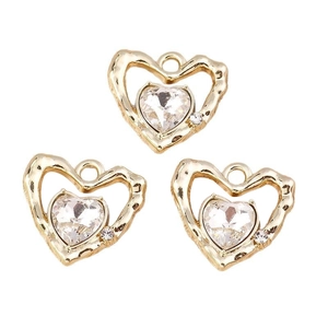 Set di 3 ciondoli a cuore Y2K dorati con texture lavica e cristalli trasparenti