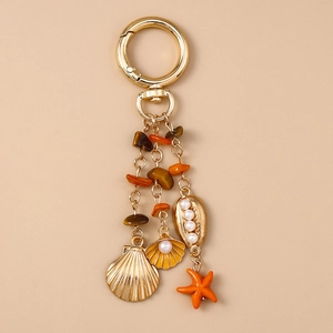 Porte-clés océan doré avec étoile de mer, coquillages, perles et pierres œil de tigre