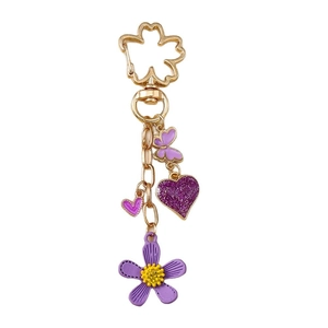 Modischer goldener Schlüsselanhänger mit lila Blume, glitzerndem Herz und Schmetterling