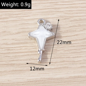 Detail view of rhinestone star pendant showing 22mm height and 12mm width dimensions