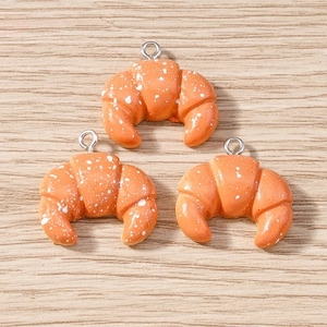 Realistic resin croissant charms with silver rings for jewelry making in a set of three pieces