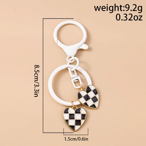 Detail view of checkered enamel heart keychains with precise size and weight measurements