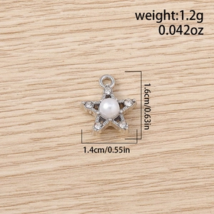 Detailed view of rhinestone star pendant with pearl accent including size measurements