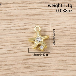 Macro view of gold starfish pendant with sparkling rhinestones and size measurements