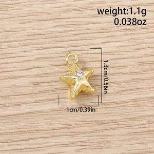 Detail showing gold star charm dimensions 1.3cm by 1cm with central zircon stone