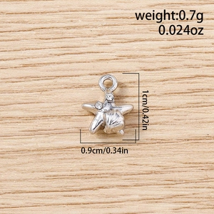 Macro detail of a silver starfish charm with rhinestones including size 1cm x 0.9cm