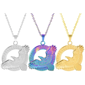 Detail of eagle circle pendants in silver, rainbow, and gold finish with spiral textures