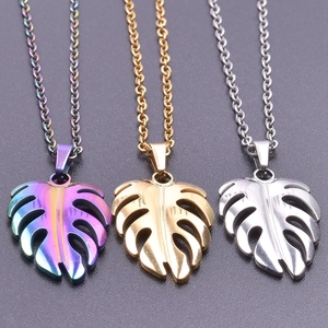 Three-color monstera leaf pendants in gold, silver and rainbow on stainless steel chains