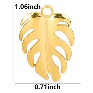 Polished gold monstera leaf pendant with 1.06 inch height and 0.71 inch width dimensions