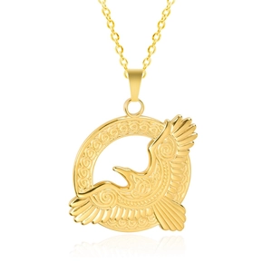Detailed macro view of a golden eagle pendant with intricate Celtic knot patterns