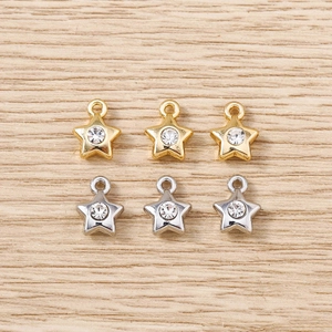 Flat lay of star charms with rhinestones in gold and silver finish for DIY jewelry making