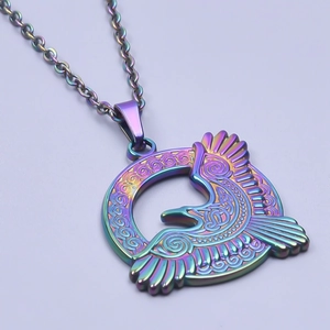 Macro detail of rainbow stainless steel eagle pendant with intricate Celtic knot patterns