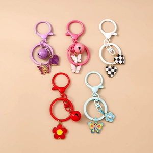 Detailed macro view of colorful macaroon keychains with heart and butterfly charms