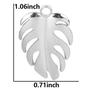 Polished silver monstera leaf pendant with precise measurements in inches