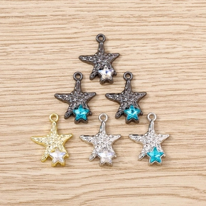 Star-shaped pendants in gold, silver and gunblack with crystal inlays for jewelry making