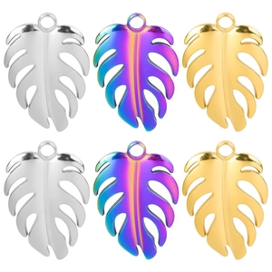 Polished stainless steel monstera leaf pendants in gold, silver, and rainbow colors