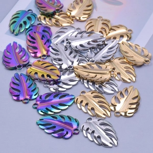 Detailed view of monstera leaf pendants in rainbow, silver, and gold for DIY jewelry