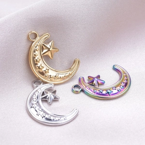 Detail of moon and star charms in gold, silver, and iridescent finishes for DIY jewelry