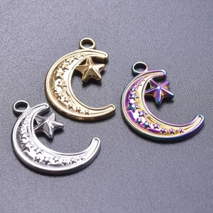 Detail of star and moon pendants in gold, silver and aurora finish for DIY jewelry