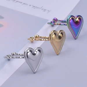 Adjustable heart rings in polished silver, brushed gold, and iridescent finishes