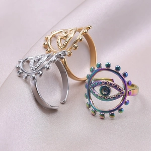Adjustable evil eye rings set in gold, silver, and rainbow stainless steel finishes