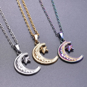 Detailed view of moon and star charms in gold, silver, and rainbow steel finishes