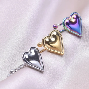 Adjustable heart-shaped stainless steel rings in silver, gold, and iridescent finishes