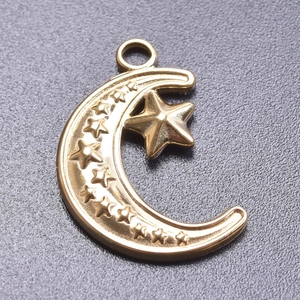 Close-up of a 18k gold plated moon and star pendant for DIY jewelry making accessories