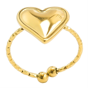 Macro detail of golden heart ring featuring a textured band and adjustable open end