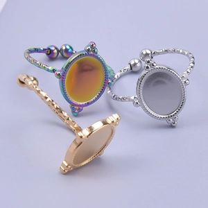 Three-piece set of adjustable stainless steel rings in gold, silver, and iridescent tones