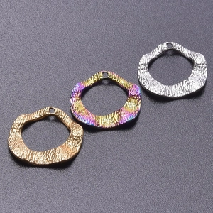 Detail view of irregular hammered rings in gold, silver, and iridescent 18k plated finish
