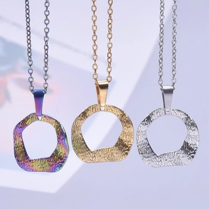 Irregular textured hoop pendant necklace in rainbow, gold, and silver finishes