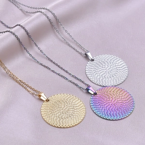 Polished round spiral pendant necklaces in gold, silver, and rainbow steel finishes