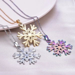 Polished snowflake pendant necklace in gold, silver, and rainbow 18k plated finishes